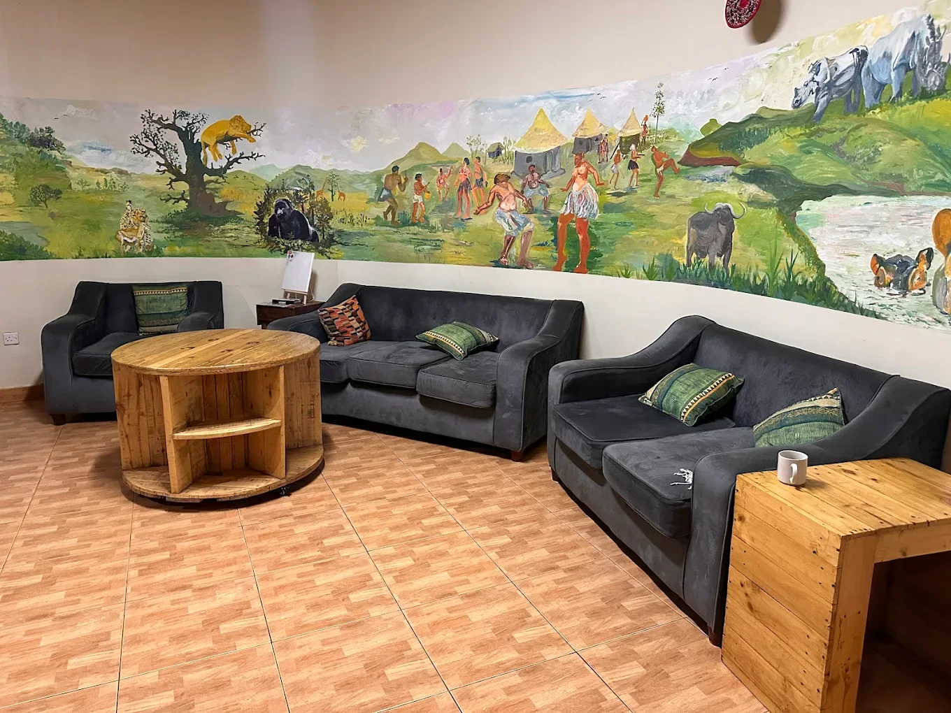 Acacia Villa lounge with Uganda wildlife mural
