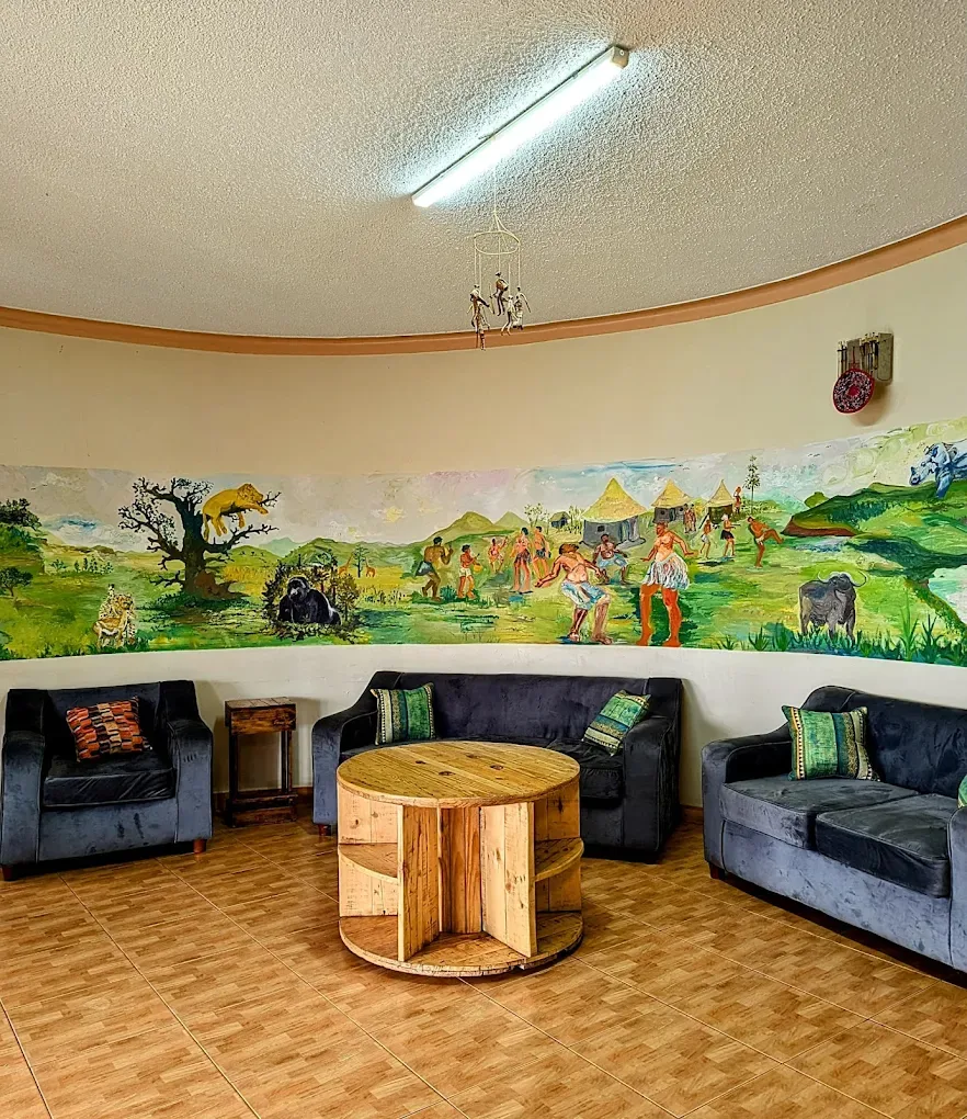 Shared lounge space for dormitory guests at Acacia Villa Kampala
